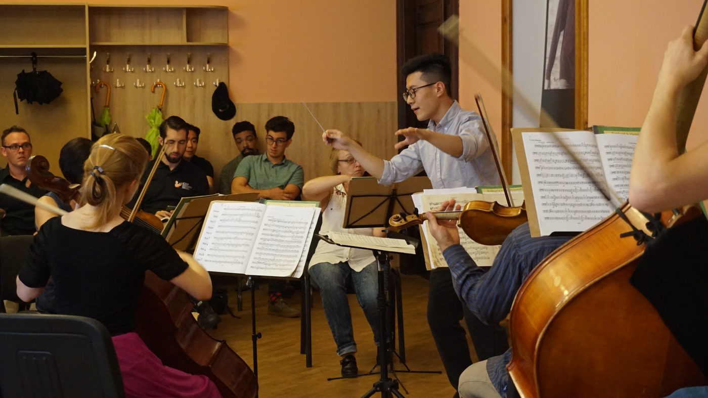 Coaching players in rehearsal